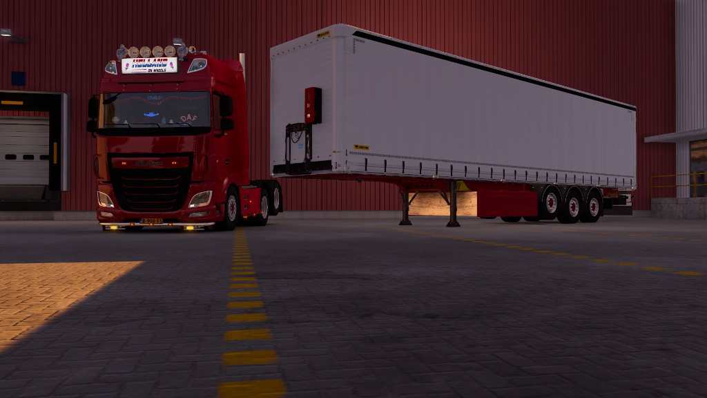 Red DAF XF with Holland On Wheels lightbox at the yard